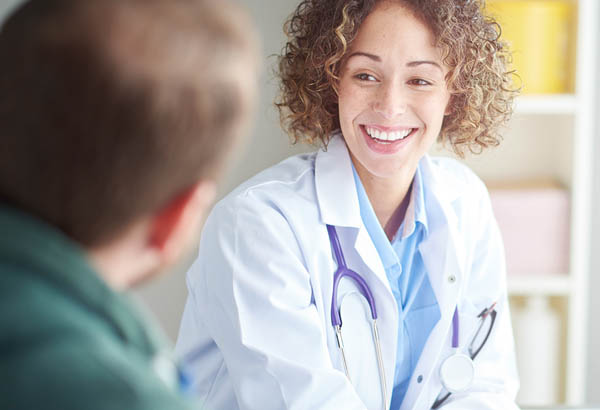 Doctor Smiling with patient.