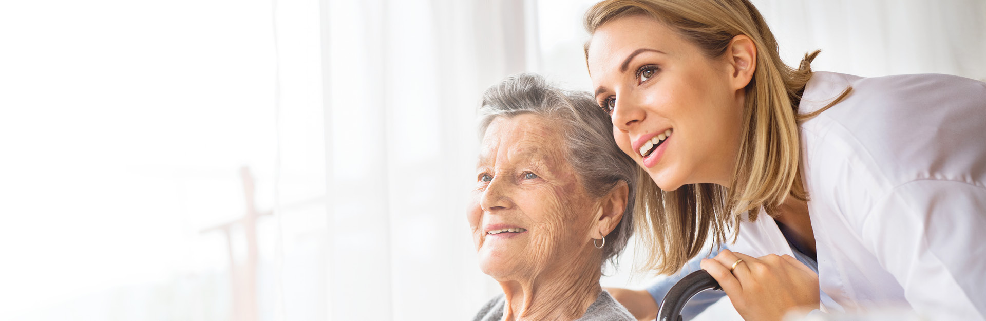 Website Banner Adoray Sept 2018 An elderly woman and her caretaker
